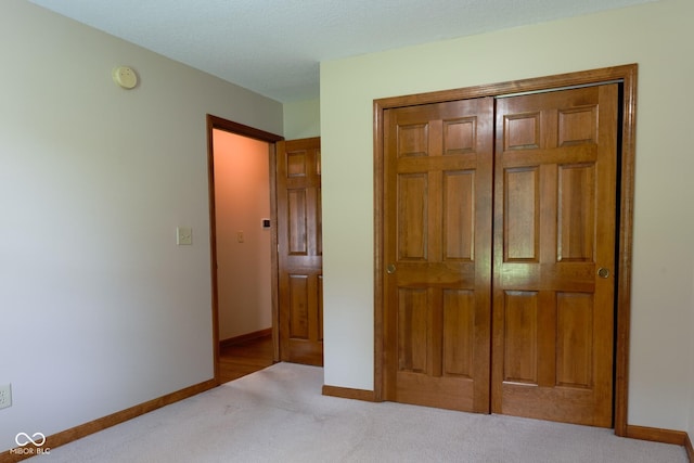 413 Blue Spring Dr, Indianapolis, IN 46239 - unfurnished bedroom featuring carpet floors and a closet