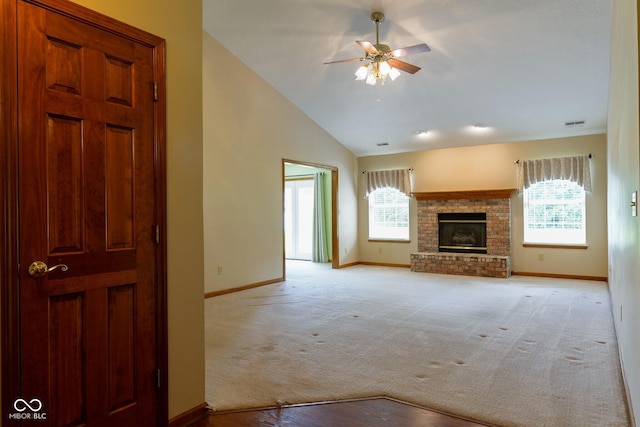 413 Blue Spring Dr, Indianapolis, IN 46239 - unfurnished living room with healthy amount of natural light, ceiling fan, light carpet, a fireplace, and high vaulted ceiling