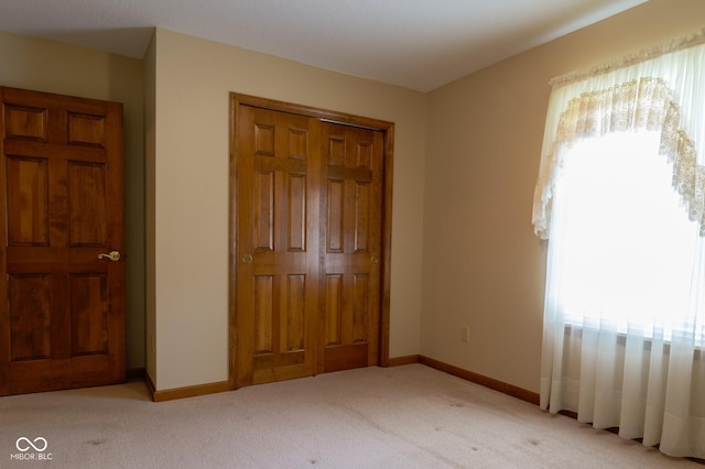 413 Blue Spring Dr, Indianapolis, IN 46239 - unfurnished bedroom featuring carpet flooring and a closet