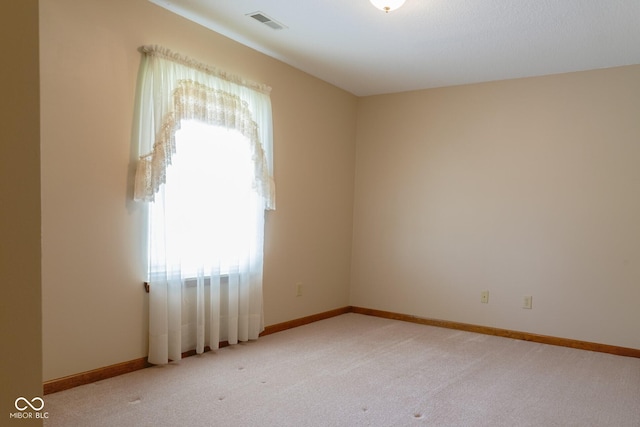 413 Blue Spring Dr, Indianapolis, IN 46239 - spare room featuring light colored carpet and baseboards
