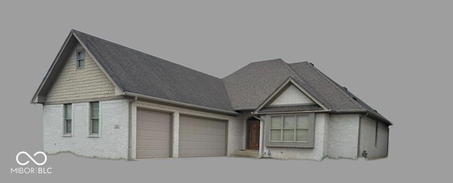 4230 Raintree Blvd, Greenwood, IN 46143 - view of front of home featuring brick siding, driveway, a shingled roof, and a garage