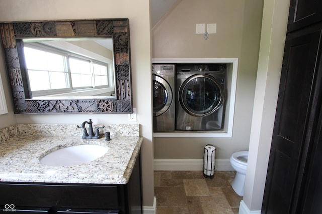 2825 E 216th St, Cicero, IN 46034 - bathroom featuring independent washer and dryer, vanity, and stone finish flooring