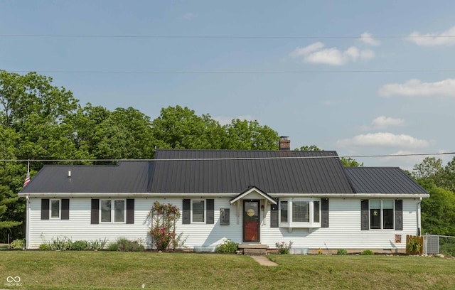 4744 S Greensboro Pike, Knightstown, IN 46148 - view of front of property featuring a chimney, a metal roof, and a front lawn