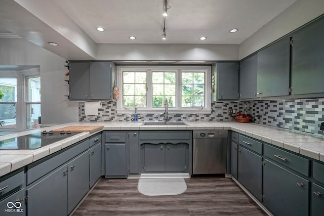 9420 N Kenwood Ave, Indianapolis, IN 46260 - kitchen with stainless steel dishwasher, black electric cooktop, backsplash, dark wood-style floors, and recessed lighting