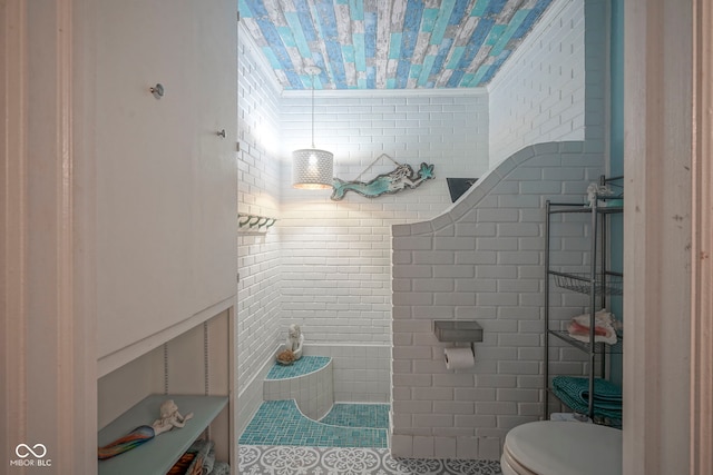 9420 N Kenwood Ave, Indianapolis, IN 46260 - bathroom with tile patterned floors and tile walls