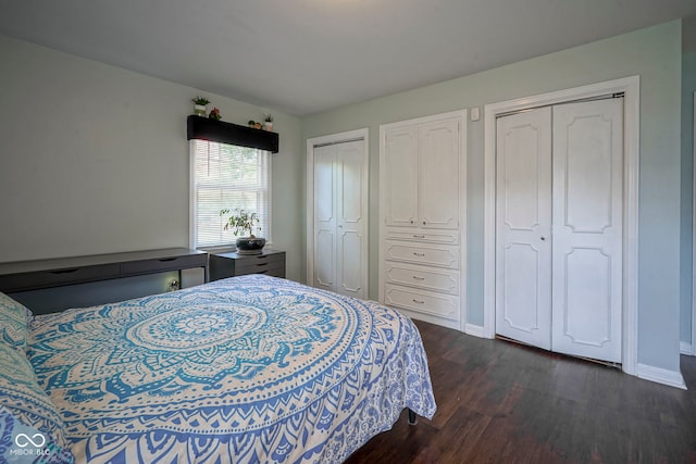 9420 N Kenwood Ave, Indianapolis, IN 46260 - bedroom featuring dark wood-style flooring and multiple closets