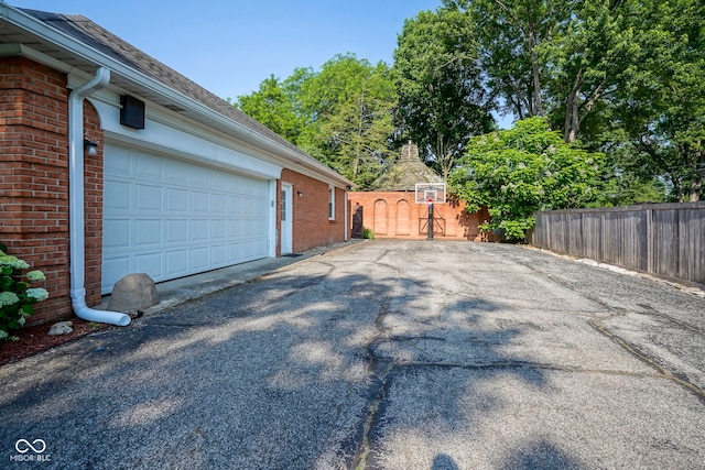 9420 N Kenwood Ave, Indianapolis, IN 46260 - garage with asphalt driveway