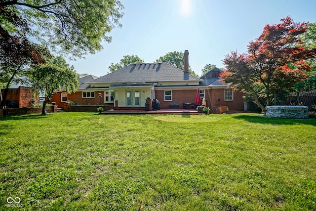 9420 N Kenwood Ave, Indianapolis, IN 46260 - back of house featuring french doors, a chimney, and a wooden deck