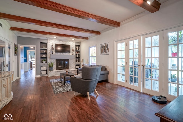 9420 N Kenwood Ave, Indianapolis, IN 46260 - living room with beam ceiling, a brick fireplace, dark wood-style floors, built in features, and french doors