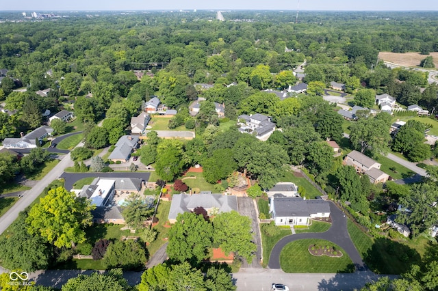 9420 N Kenwood Ave, Indianapolis, IN 46260 - aerial view of property and surrounding area featuring nearby suburban area and a heavily wooded area