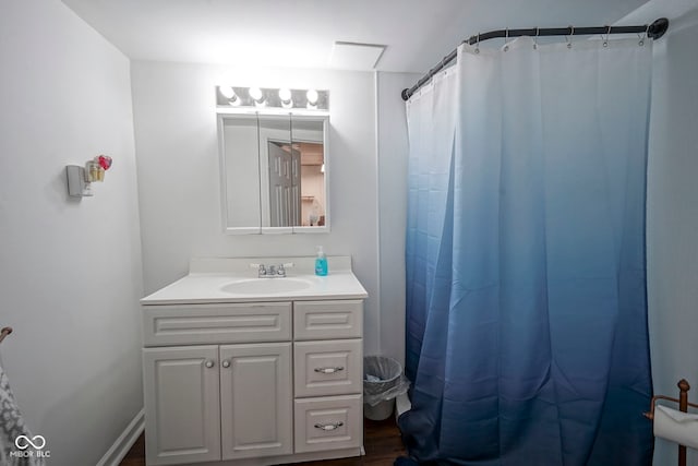 9420 N Kenwood Ave, Indianapolis, IN 46260 - bathroom with vanity, wood finished floors, and curtained shower