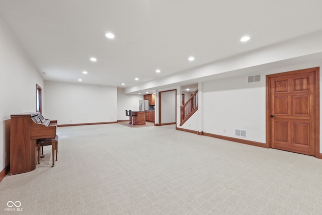 5274 Brooks Bnd, Greenwood, IN 46143 - finished basement with recessed lighting, light carpet, bar area, freestanding refrigerator, and stairs