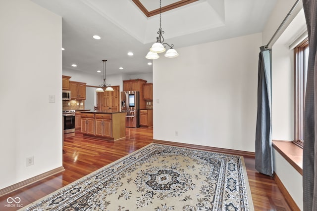5274 Brooks Bnd, Greenwood, IN 46143 - living area with dark wood-style floors, recessed lighting, and a raised ceiling