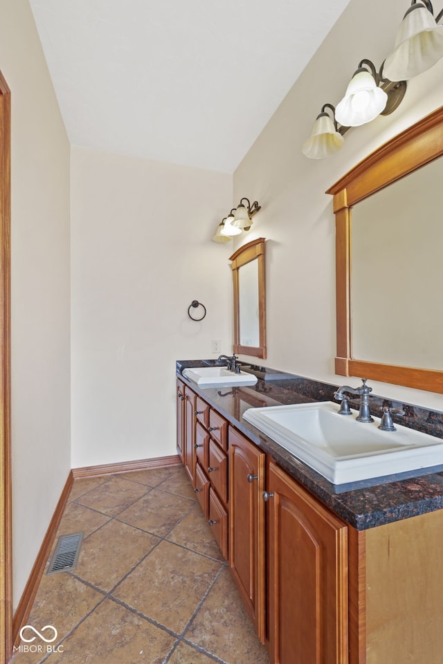 5274 Brooks Bnd, Greenwood, IN 46143 - bathroom with double vanity and stone tile floors