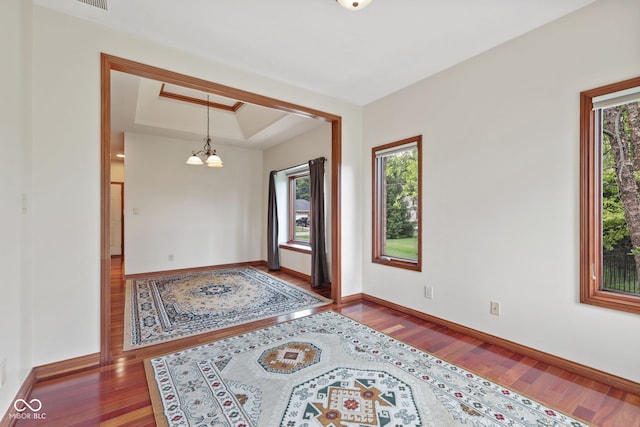 5274 Brooks Bnd, Greenwood, IN 46143 - foyer with a raised ceiling, a chandelier, and wood finished floors