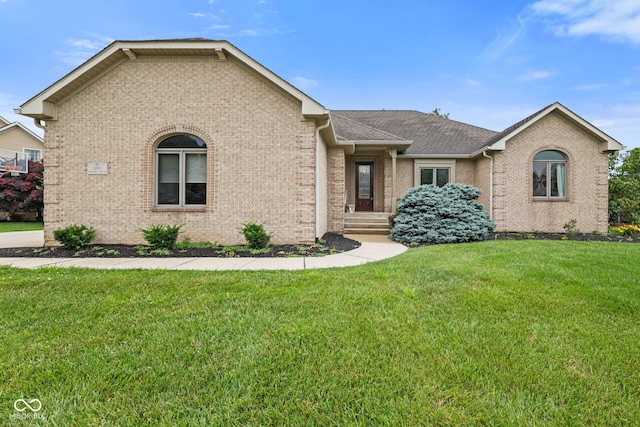5274 Brooks Bnd, Greenwood, IN 46143 - view of front of house with brick siding, a front yard, and a shingled roof
