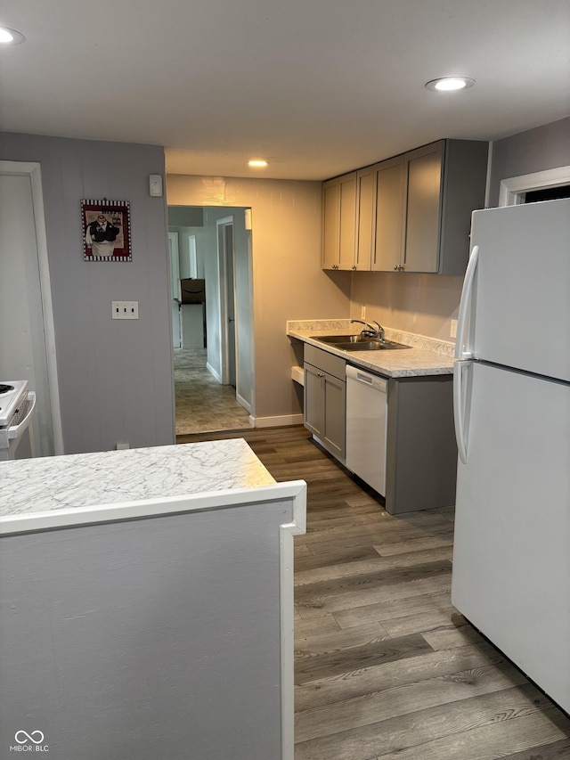 4630 W 71st St, Indianapolis, IN 46268 - kitchen featuring white appliances, recessed lighting, light countertops, dark wood-type flooring, and gray cabinets