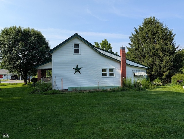180 N Pike St, Vernon, IN 47282 - view of side of home with a yard and a chimney