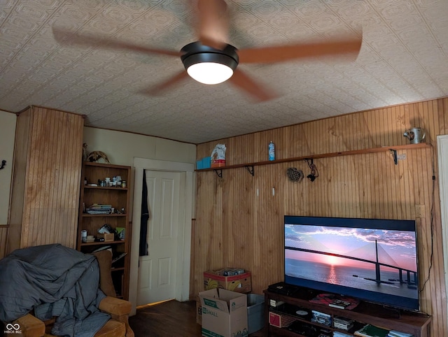 180 N Pike St, Vernon, IN 47282 - living area with an ornate ceiling, wood walls, ceiling fan, and wood finished floors