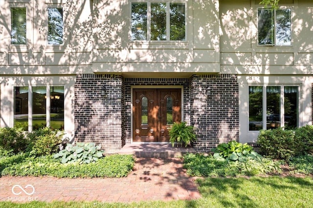 54 Horseshoe Ln, Carmel, IN 46033 - entrance to property featuring brick siding and french doors