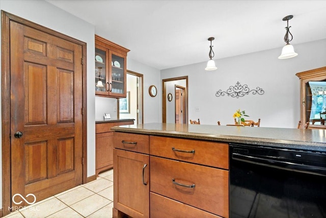 54 Horseshoe Ln, Carmel, IN 46033 - kitchen with brown cabinets, pendant lighting, glass insert cabinets, and light tile patterned flooring