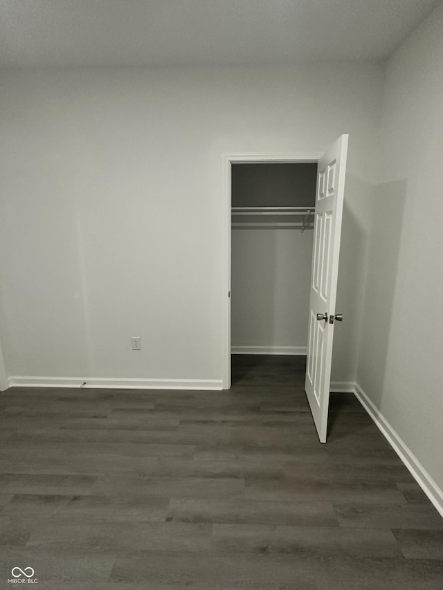 2127 Haines Ave, Indianapolis, IN 46221 - unfurnished bedroom featuring dark wood-type flooring and a closet