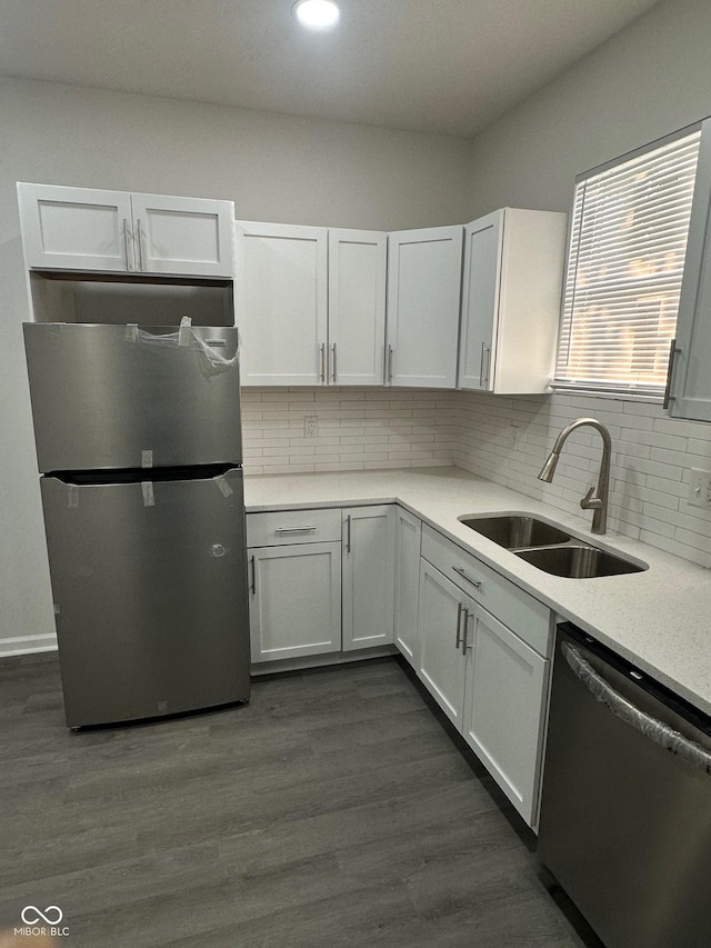 2127 Haines Ave, Indianapolis, IN 46221 - kitchen featuring stainless steel appliances, light countertops, decorative backsplash, white cabinetry, and recessed lighting