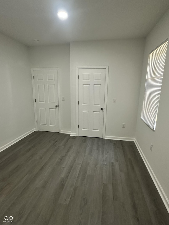 2127 Haines Ave, Indianapolis, IN 46221 - spare room featuring dark wood-type flooring and baseboards