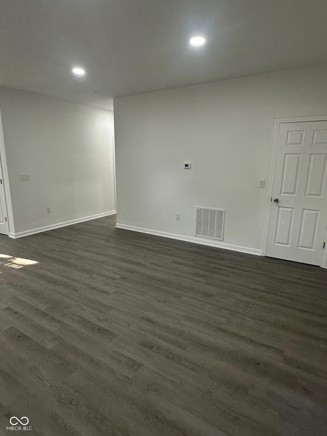 2127 Haines Ave, Indianapolis, IN 46221 - unfurnished room featuring dark wood-type flooring and recessed lighting