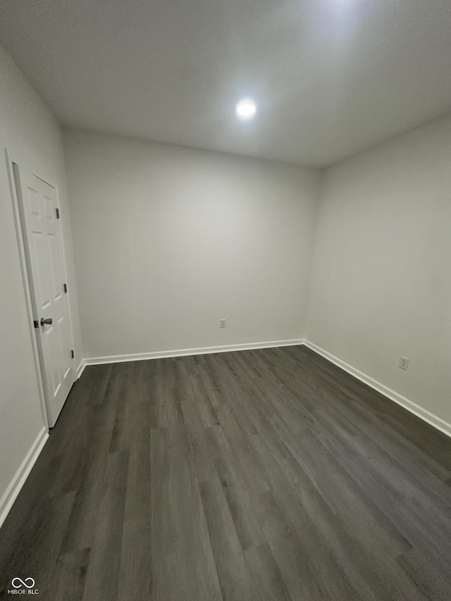 2127 Haines Ave, Indianapolis, IN 46221 - unfurnished room featuring dark wood-style flooring and recessed lighting