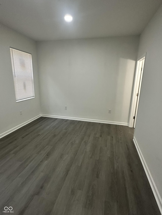 2127 Haines Ave, Indianapolis, IN 46221 - empty room with dark wood-style flooring and baseboards