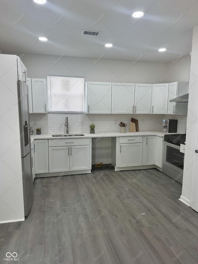 2127 Haines Ave, Indianapolis, IN 46221 - kitchen featuring stove, light countertops, and backsplash