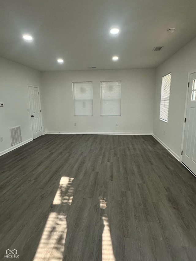 2127 Haines Ave, Indianapolis, IN 46221 - unfurnished living room featuring recessed lighting and dark wood-style floors
