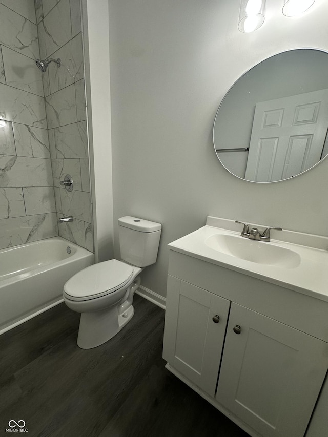 2127 Haines Ave, Indianapolis, IN 46221 - full bath featuring vanity, wood finished floors, and washtub / shower combination