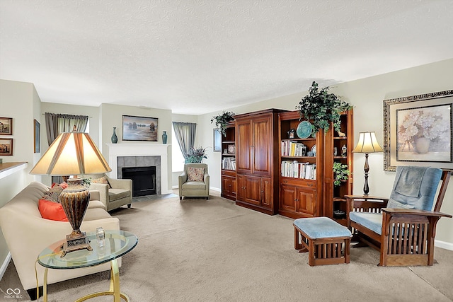 8038 Sydney Ln, Avon, IN 46123 - living area featuring light carpet, a textured ceiling, and a tile fireplace