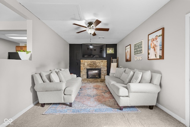 405 W Jacob St, Greencastle, IN 46135 - carpeted living room featuring a stone fireplace and ceiling fan