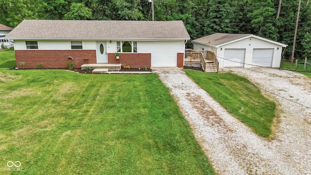 405 W Jacob St, Greencastle, IN 46135 - ranch-style house featuring a garage, an outbuilding, brick siding, a front yard, and a shingled roof