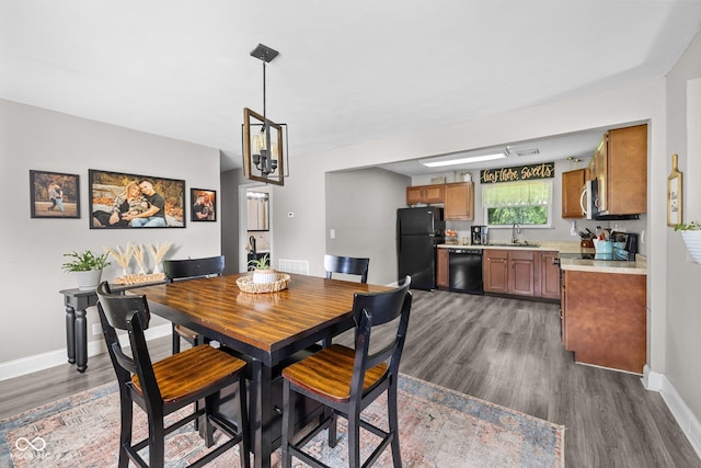 405 W Jacob St, Greencastle, IN 46135 - dining area featuring dark wood finished floors and a chandelier