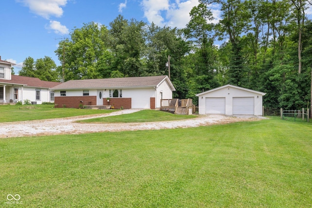 405 W Jacob St, Greencastle, IN 46135 - ranch-style home featuring an outbuilding, a garage, brick siding, and a wooden deck