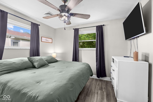 405 W Jacob St, Greencastle, IN 46135 - bedroom with dark wood finished floors and a ceiling fan