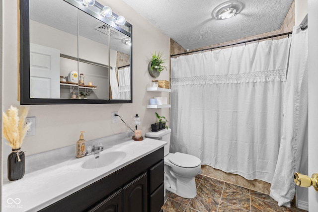 405 W Jacob St, Greencastle, IN 46135 - full bathroom featuring vanity, a textured ceiling, a shower with shower curtain, and stone finish floors