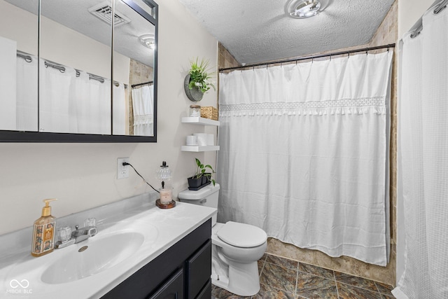 405 W Jacob St, Greencastle, IN 46135 - full bathroom featuring vanity, a textured ceiling, stone finish flooring, and curtained shower