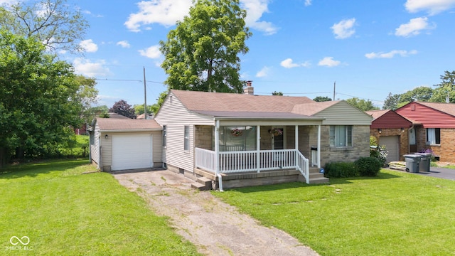 1020 N Ritter Ave, Indianapolis, IN 46219 - view of front of property with a porch, driveway, a front yard, and a shingled roof