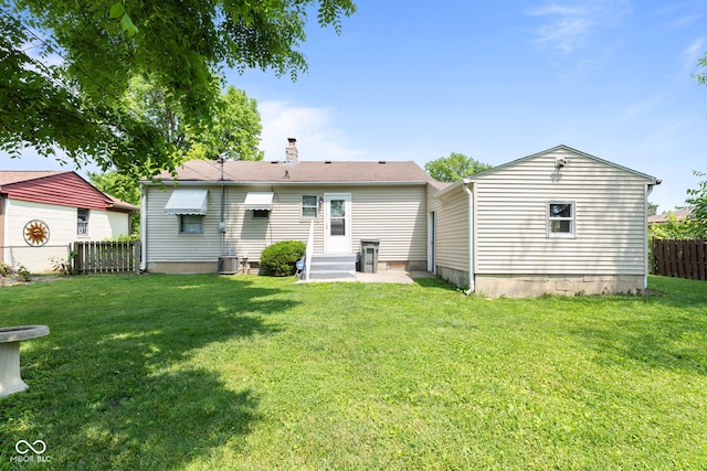 1020 N Ritter Ave, Indianapolis, IN 46219 - rear view of property featuring entry steps and a chimney