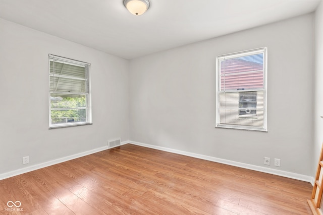 1020 N Ritter Ave, Indianapolis, IN 46219 - unfurnished room with wood finished floors and baseboards