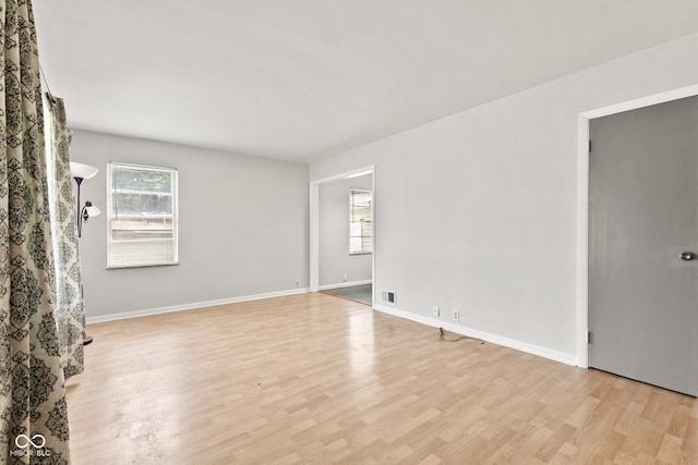 1020 N Ritter Ave, Indianapolis, IN 46219 - spare room featuring light wood-style floors and baseboards