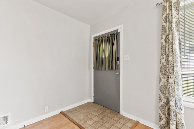 1020 N Ritter Ave, Indianapolis, IN 46219 - spare room featuring baseboards and light wood-style floors