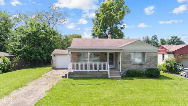 1020 N Ritter Ave, Indianapolis, IN 46219 - view of front facade with a porch, driveway, a garage, and stone siding