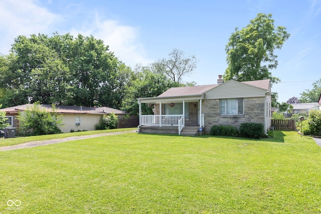 1020 N Ritter Ave, Indianapolis, IN 46219 - view of front of home featuring a porch, stone siding, and a chimney