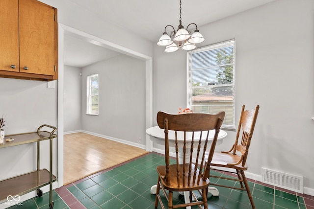 1020 N Ritter Ave, Indianapolis, IN 46219 - dining room with a chandelier and dark tile patterned floors